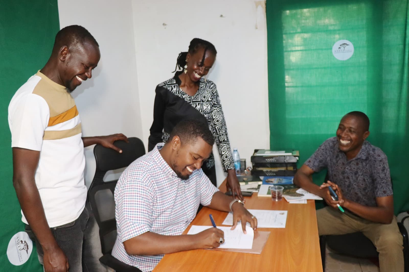 Delegation from ASREP Africa and AGAR signing the MOU Framework Agreement document at the official ceremony